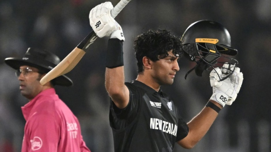 New Zealand’s Rachin Ravindra celebrates after reaching his century against Bangladesh