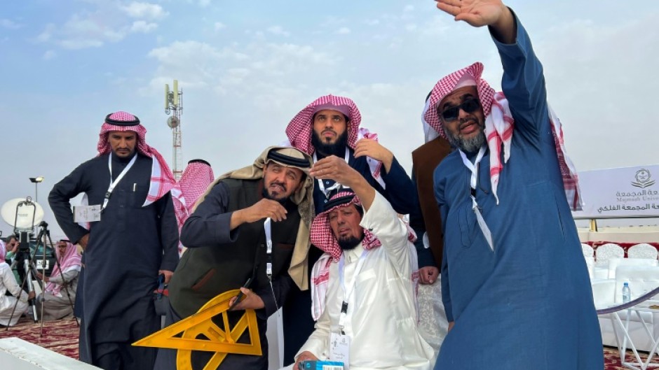 The Saudi moon-spotting team used a large yellow triangle and protractor to help work out where the crescent moon will appear