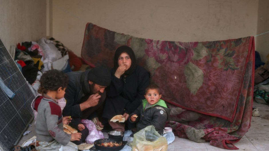 A displaced Palestinian family gathers for the iftar fast-breaking meal on the first day of Ramadan