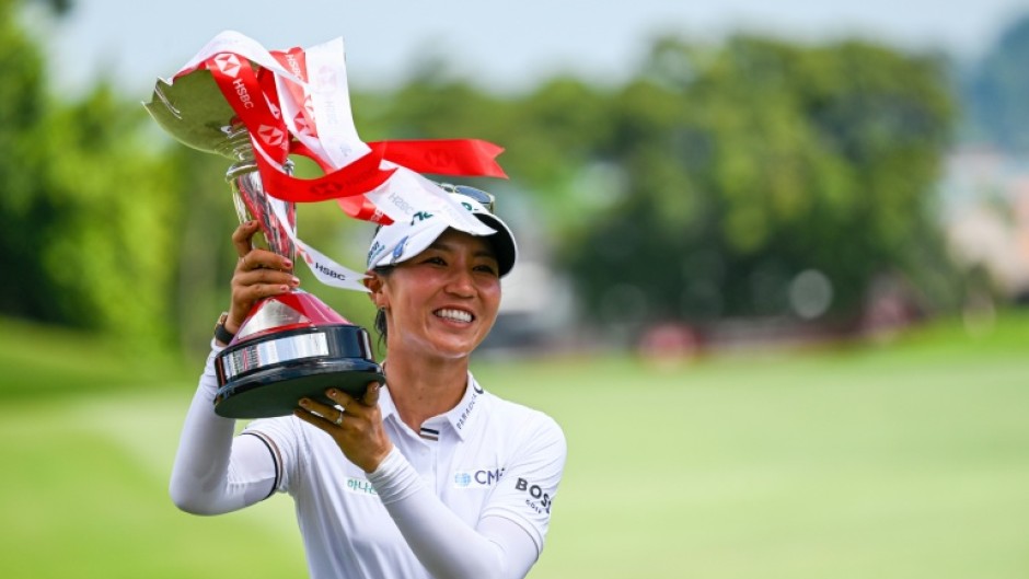 Lydia Ko celebrates with with the trophy after winning the HSBC Women's World Championship 