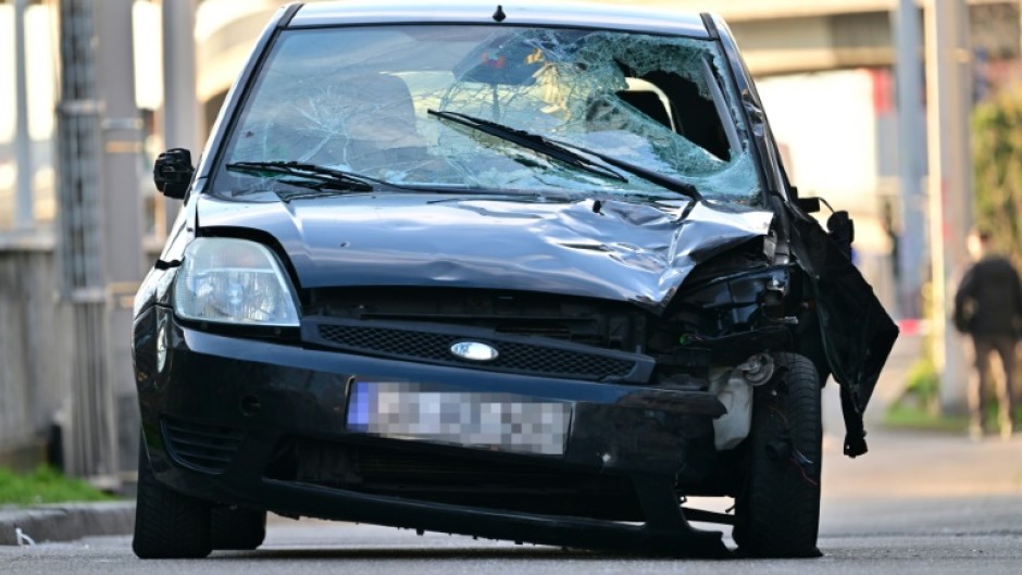 A damaged car is pictured at the site of the car ramming 