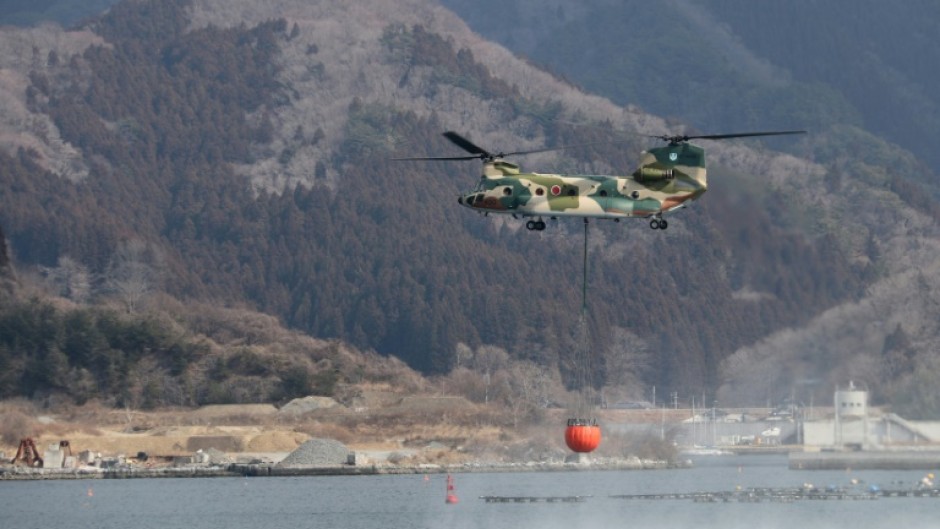 Military and fire department helicopters have been trying to douse the wildfire