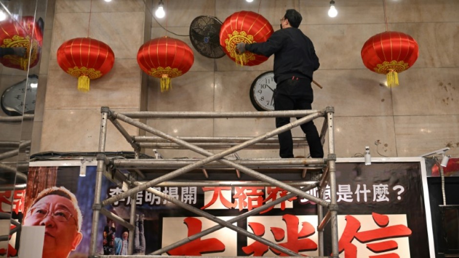 Its lobby was adorned with calligraphy, a gong and drum for good luck -- as well as 108 round lamps suspended from the ceiling