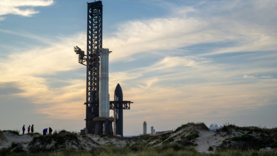 People view SpaceX Starship Flight 8 as it is stationed near Orbital Launch Pad A ahead of launch at Boca Chica beach in Texas on March 3, 2025