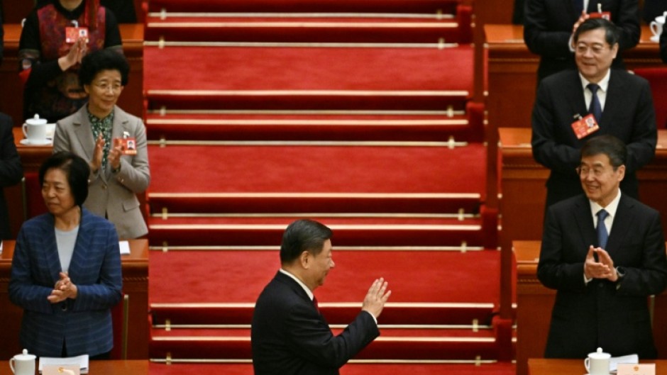 China's President Xi Jinping arrives for the opening session of the National People's Congress (NPC) on Wednesday