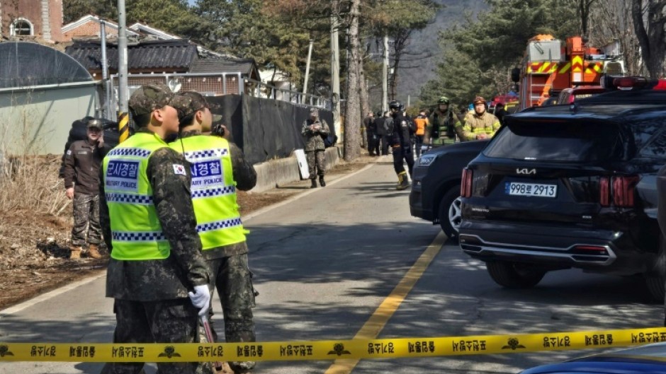 South Korean soldiers stand near a bomb accident site outside a military live-fire training range in Pocheon