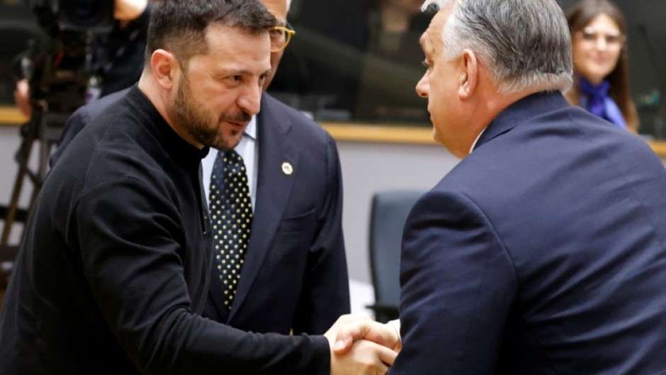 Hungary's Prime Minister Viktor Orban (R) regularly breaks EU unity on Ukraine