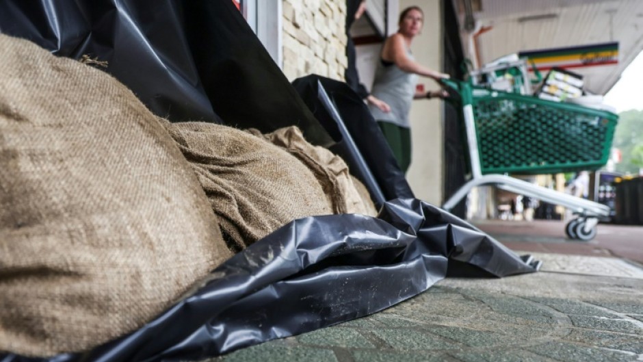 'Erratic' Tropical Cyclone Alfred brought drenching rain and huge surf to the eastern coast of Australia