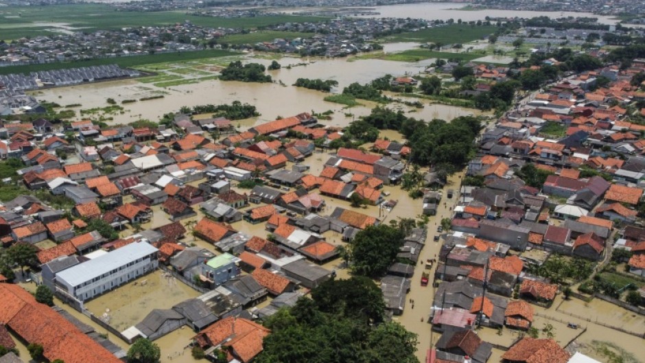 An aerial picture shows a flooded residential area after some rivers overflowed following heavy rain in Bekasi, a suburb of Jakarta, on March 5, 2025
