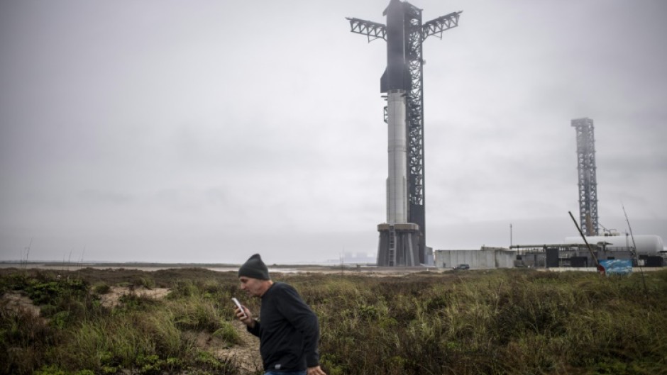A visitor walks near the launch site of the SpaceX Starship rocket on January 14, 2025, near Boca Chica, Texas