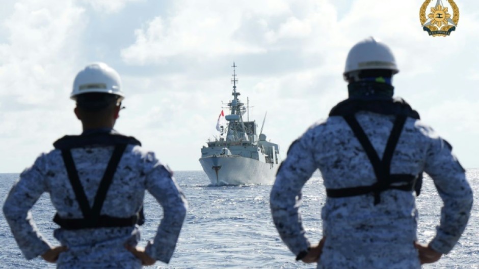 Filipino sailors watch a Canadian warship during joint maritime exercises in August 2024. A new deal has been negotiated that will allow exercises on land too