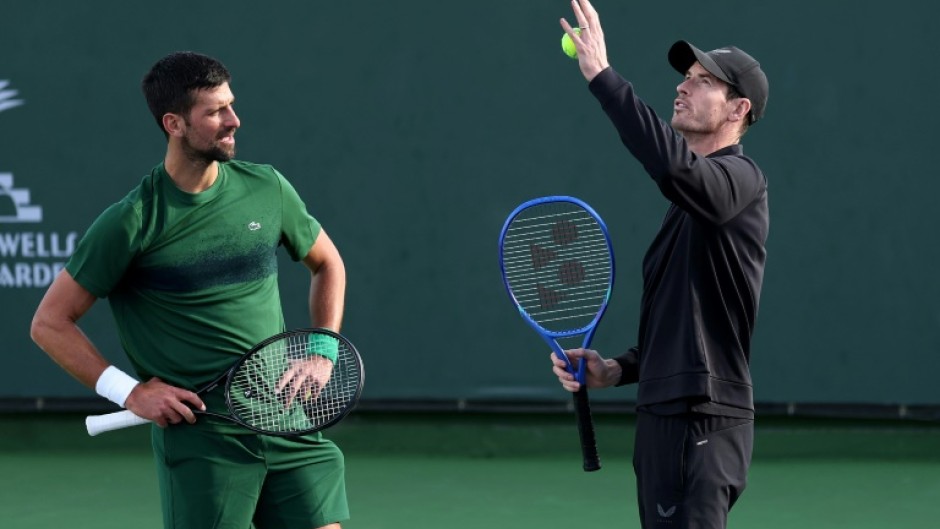Novak Djokovic and coach Andy Murray work on the Serbian star's serve during practice prior at the Indian Wells ATP Masters