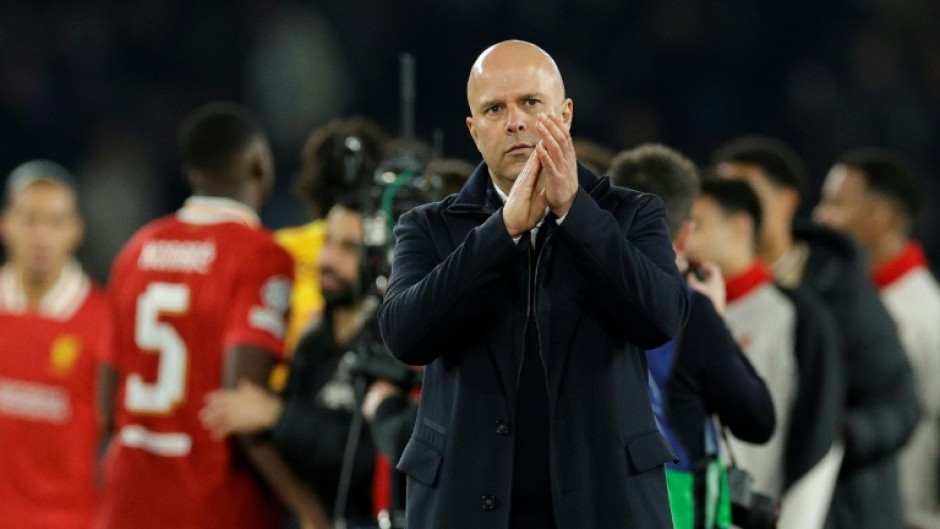 Arne Slot applauds fans after Liverpool's 1-0 win against Paris Saint-Germain in the first leg of their last-16 tie in the Champions League