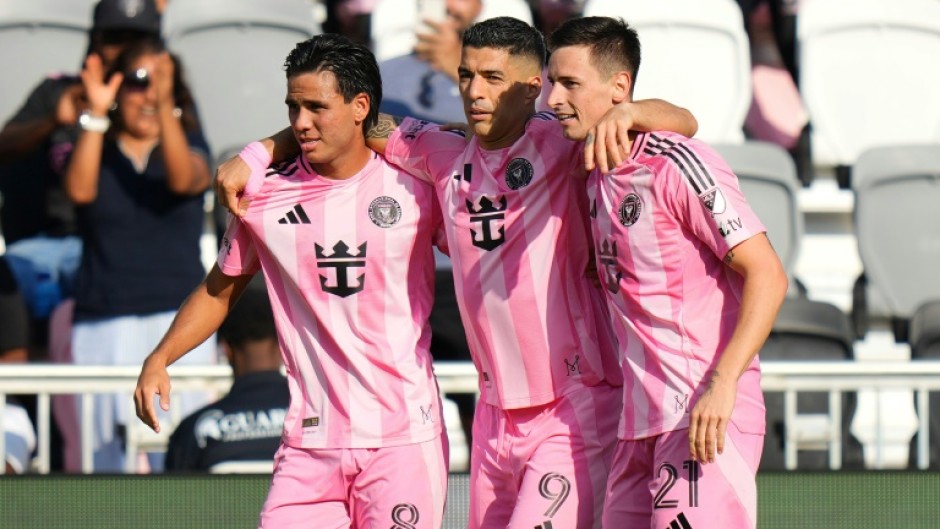Tadeo Allende #21 of Inter Miami celebrates with teammates Luis Suárez #9 and Telasco Segovia #8 after scoring in the 1-0 win over Charlotte in MLS on Sunday.