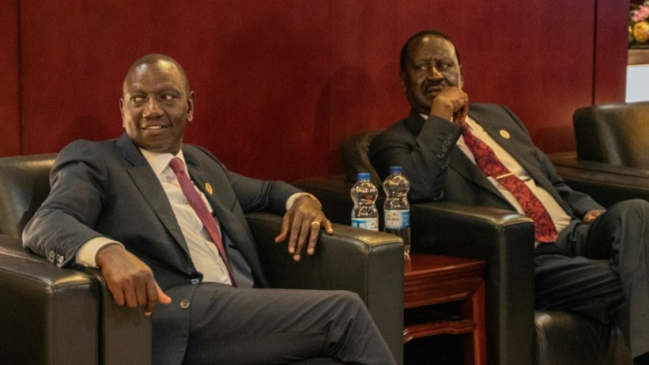 Kenyan President William Ruto (L) and opposition veteran Raila Odinga signed a deal to 'help ease the prevailing tension' in the country
