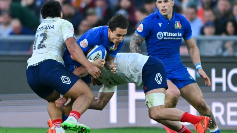 Italy's Ange Capuozzo (2nd L)