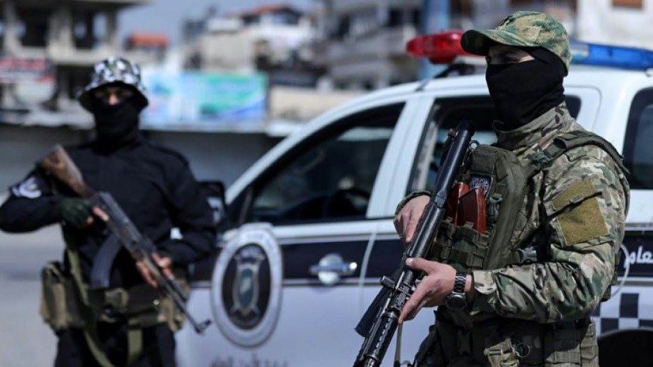 A picture released by the official Syrian Arab News Agency showing Syrian security forces at a checkpoint in the coastal city of Latakia