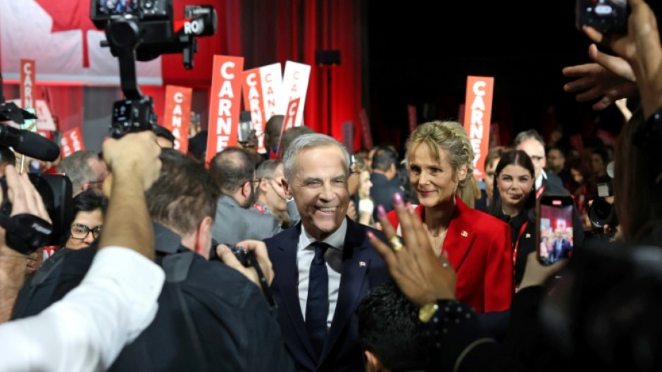 Canada's Liberal Leader and Prime Minister-elect Mark Carney greets supporters in Ottawa on March 9, 2025