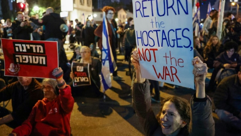 Family members and friends of Israeli hostages held in Gaza deamnd their government implement the ceasefire rather than restart the war 