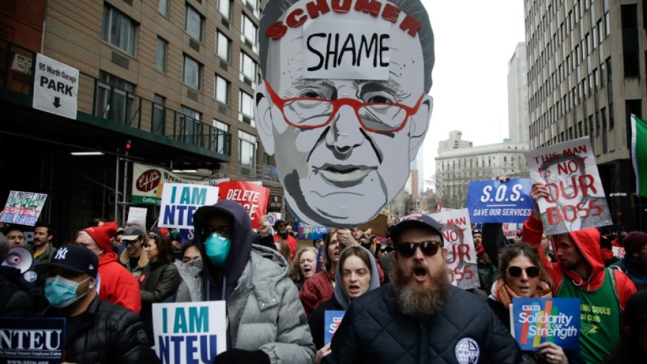 Demonstrators take part in a "March to Stop the Cuts" protest in New York 