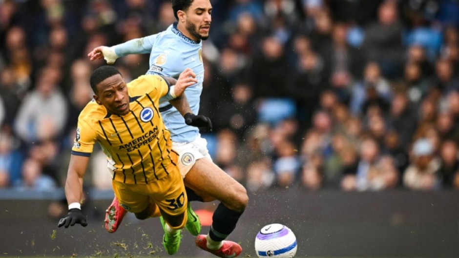 Manchester City forward Omar Marmoush (R) scored against Brighton