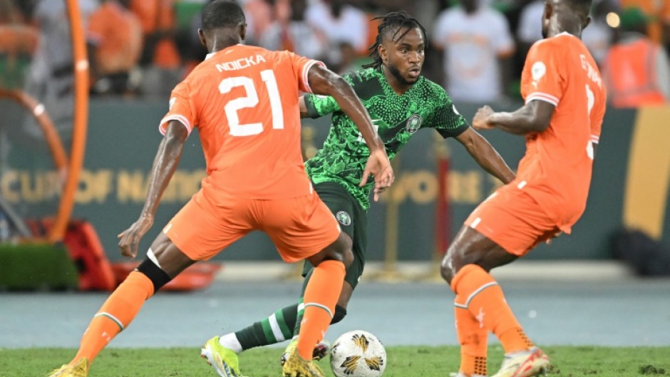 Nigeria star Ademola Lookman (C) takes on two Ivory Coast defenders during the 2024 Africa Cup of Nations final in Abidjan