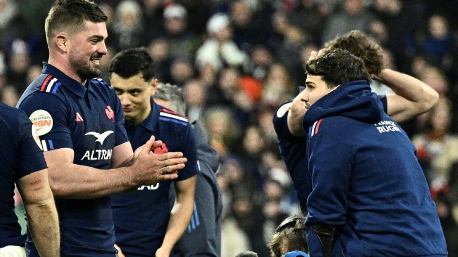 Gregory Alldritt (L) celebrates the Six Nations win with Antoine Dupont (R) 
