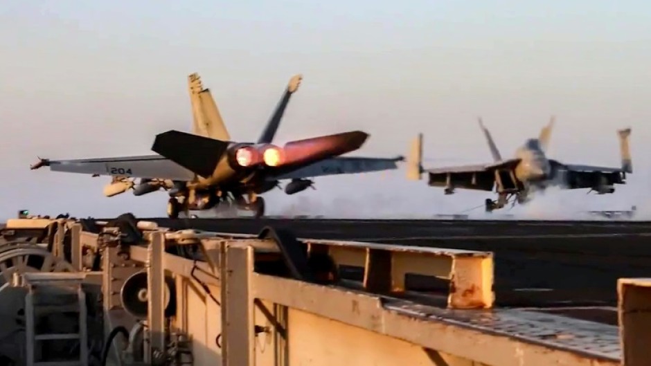 US Navy F/A-18 fighter aircraft operate on an aircraft carrier at sea reportedly during operations against Yemen Huthi rebels