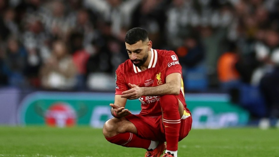 Liverpool forward Mohamed Salah reacts to the team's League Cup defeat by Newcastle