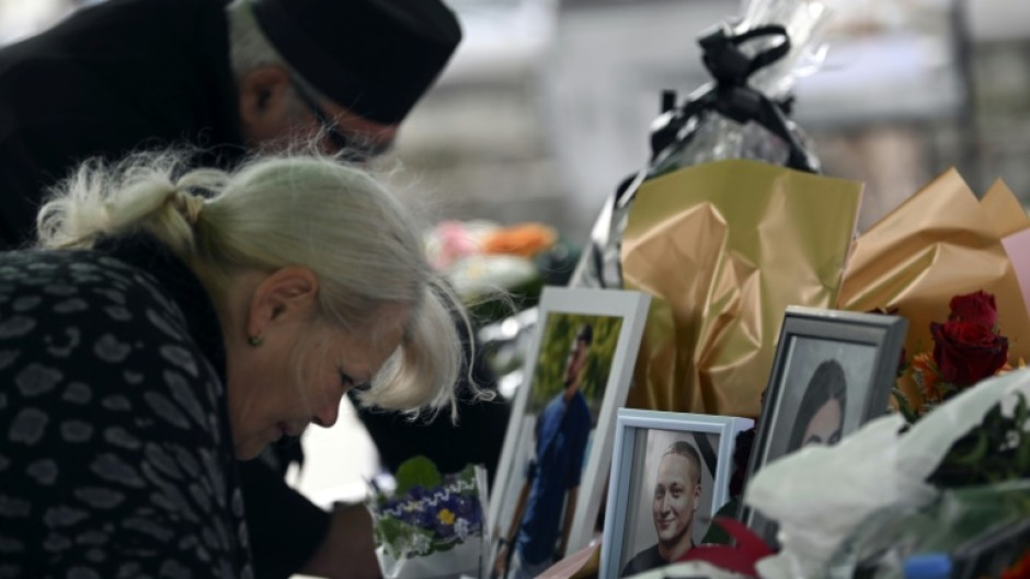 Mourners left flowers and messages for the 59 people killed in the fire in Kocani