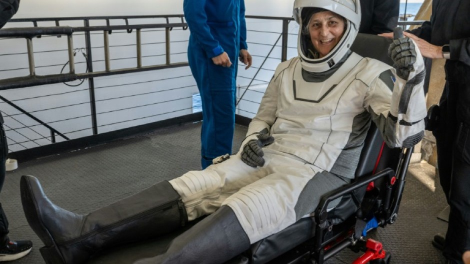 This photo provided by NASA shows NASA astronaut Suni Williams being helped out of a SpaceX Dragon spacecraft on board the SpaceX recovery ship MEGAN 