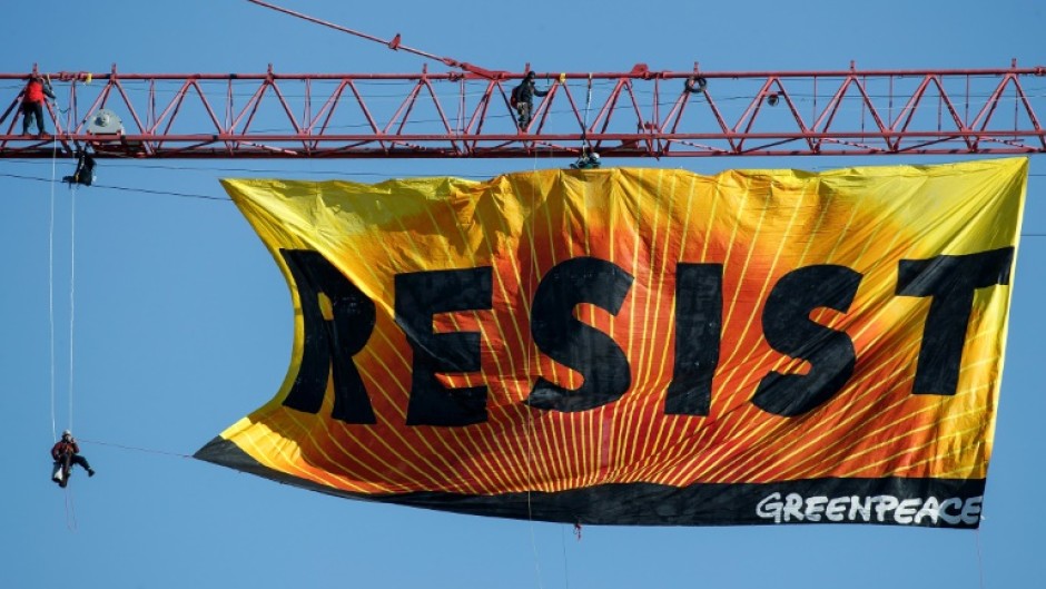 Greenpeace has vowed to continue its environmental work despite the ruling
