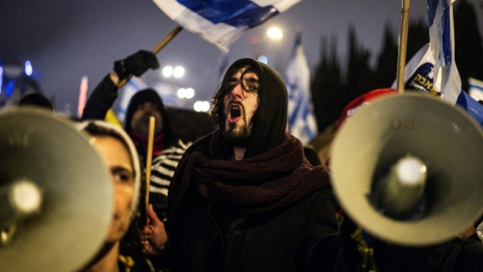 Protesters in Jerusalem demonstrate against Netanyahu's decision to oust the Shin Bet chief