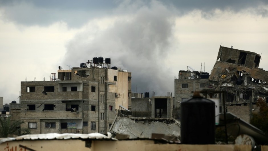 Smoke billows after an Israeli strike near the Bureij refugee camp in the central Gaza Strip