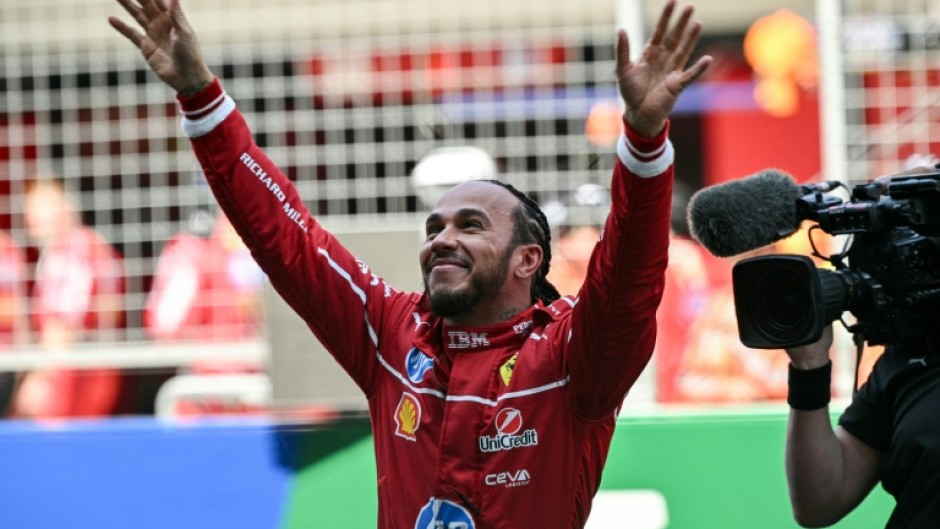 Lewis Hamilton celebrates winning the sprint race of the Formula One Chinese Grand Prix