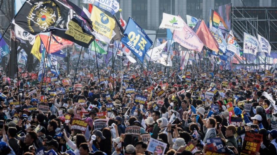 Protesters attend a demonstration against impeached South Korean President Yoon Suk Yeol in Seoul on March 22, 2025