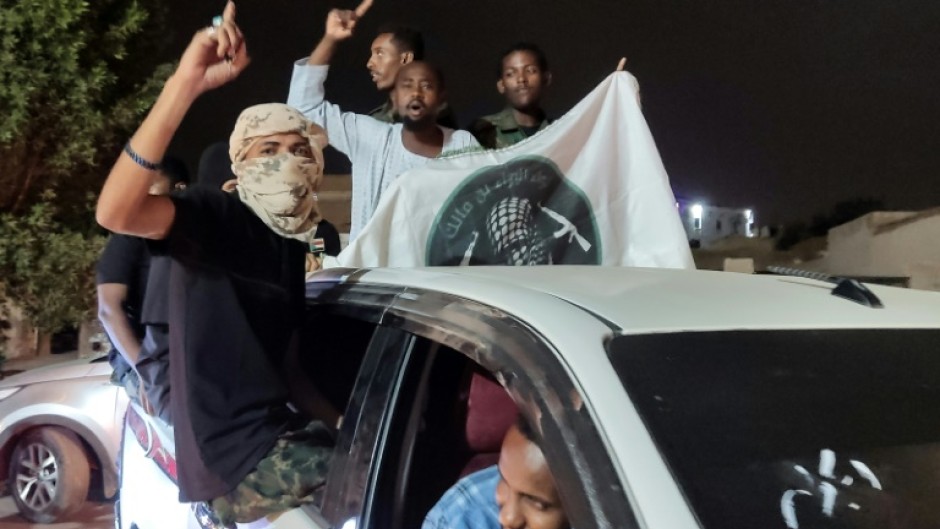 Celebrations erupt in the Red Sea city of Port Sudan, seat of Sudan's army-backed government, at the news that it has retaken the presidential palace in Khartoum.