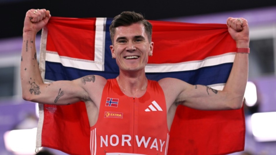 Norway's Jakob Ingebrigtsen celebrates winning he men's 3000m final at the Indoor World Athletics Championships in Nanjing, China