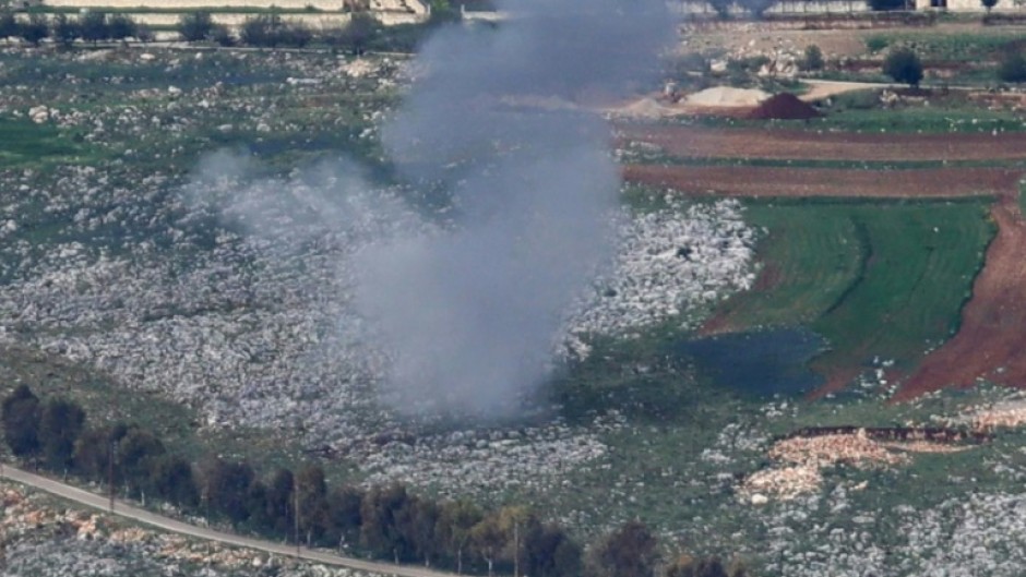 An Israeli shell hits farmland near the south Lebanon village of Yohmor as defence chiefs threaten a severe response to renewed rocket fire from Lebanon.