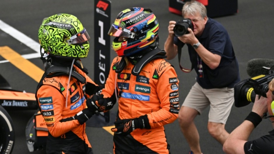 Oscar Piastri (right) and Lando Norris celebrate the McLaren one-two in China
