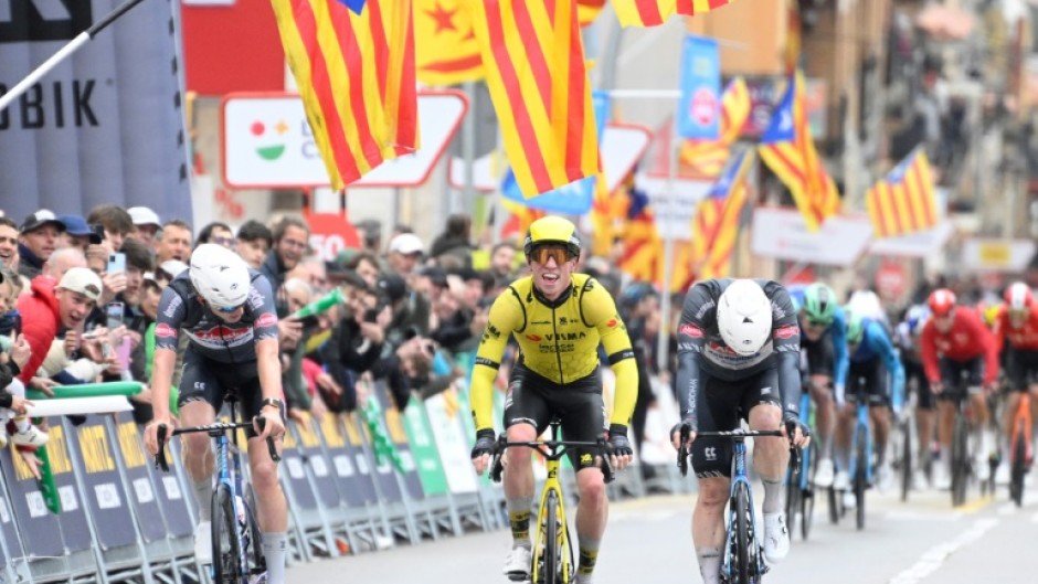 Team Visma's British rider Matthew Brennan (C) snatched victory in stage one of the Tour of Catalonia