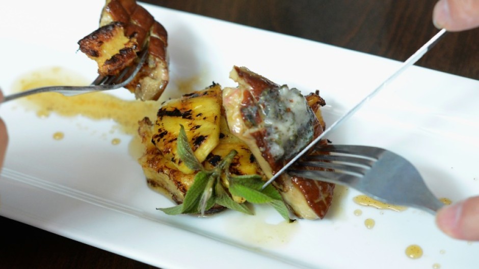 Customers eat gourmet food made with foie gras at Hot's Kitchen during a "Farewell Fois Gras" event on June 29, 2012 in Hermosa Beach, California