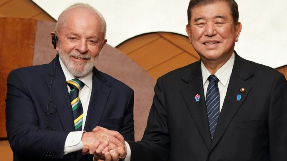 Brazilian President Luiz Inacio Lula da Silva (L) said his country and Japan had ' more to gain from integration than from protectionist practices'