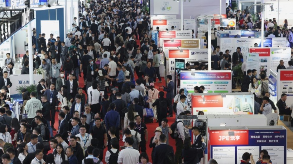 People attend the SEMICON China semiconductor exhibition in Shanghai on March 26, 2025.