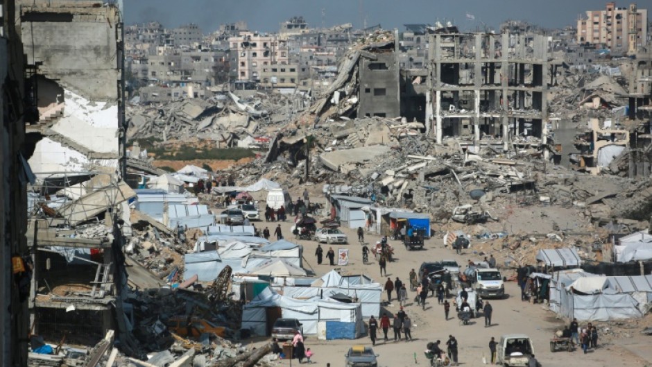 Palestinians flee Israeli bombardment in Beit Lahia in the northern Gaza Strip