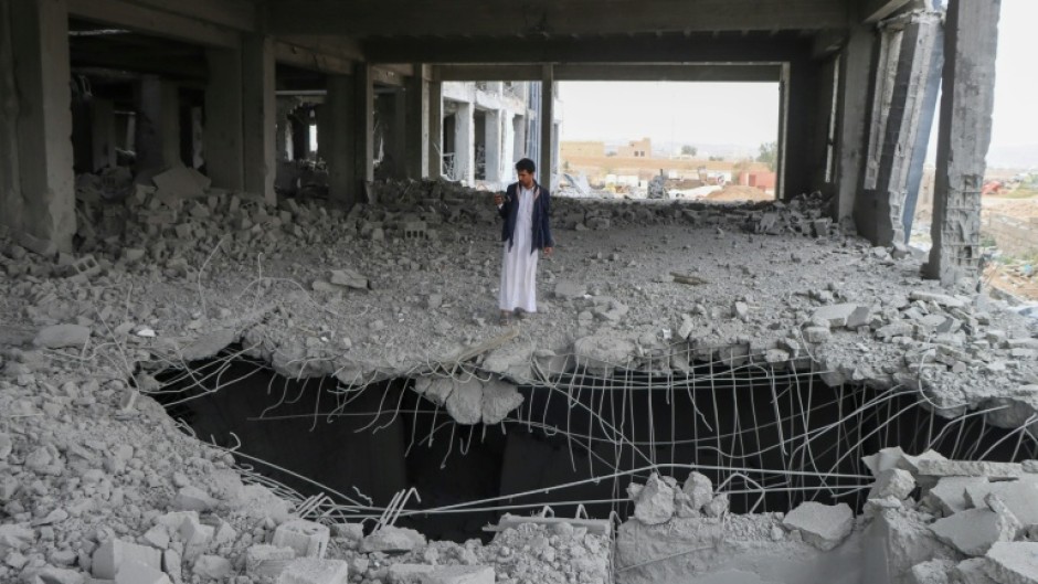 A Yemeni man inspects the damage in the Al-Rasul Al-Aadham cancer and oncology hospital's unfinished building, a day after it was hit in a US strike in Yemen's northern Saada province