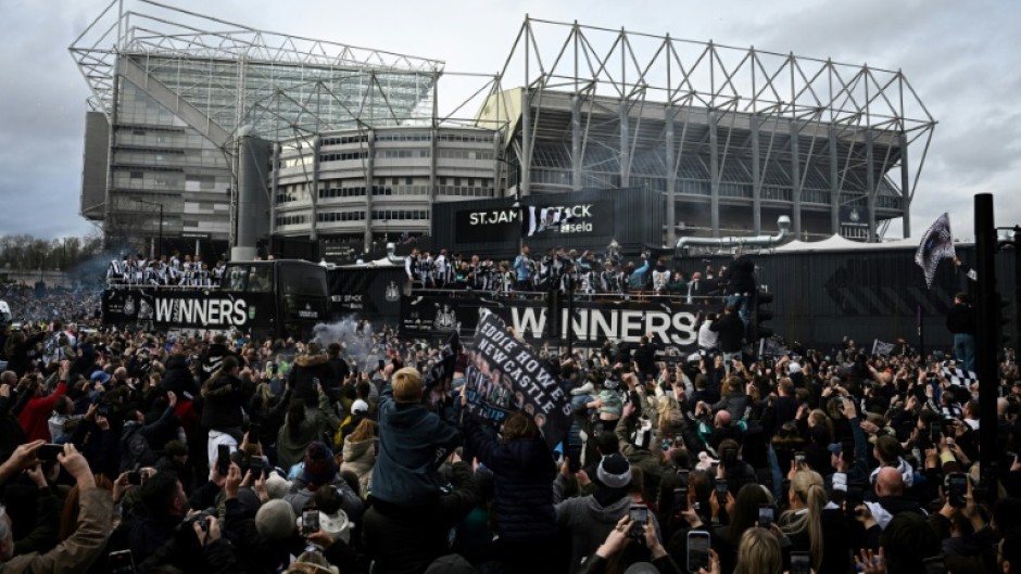 Newcastle players paraded a first domestic trophy in 70 years through the city