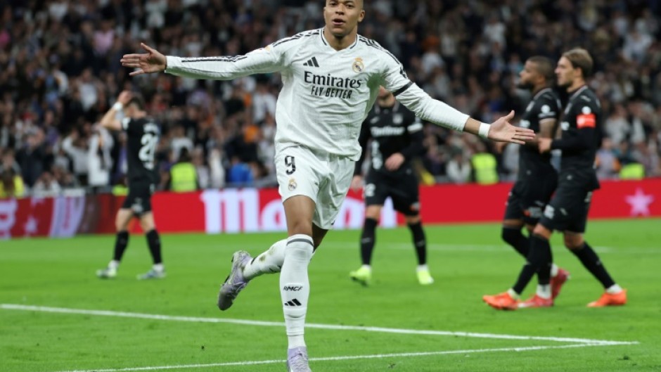 Real Madrid's French forward Kylian Mbappe struck twice as Los Blancos caught up with Barcelona in La Liga