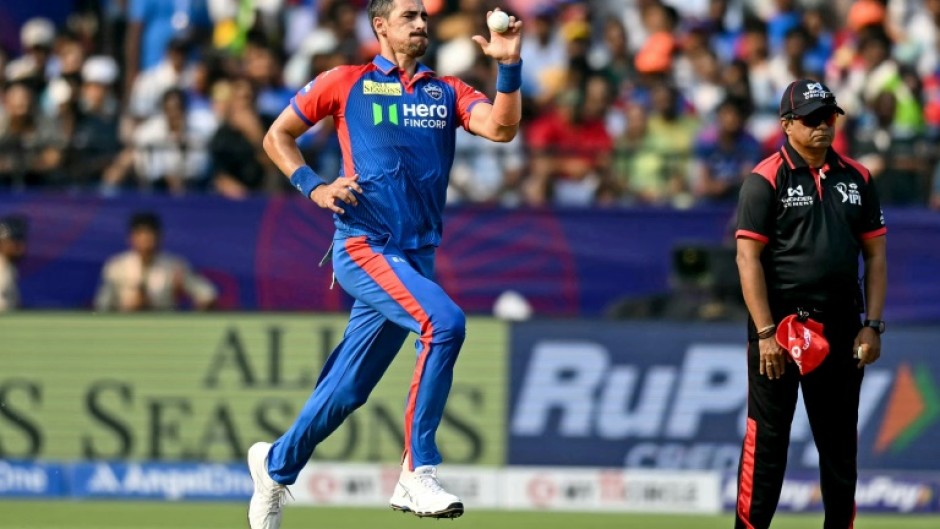 Mitchell Starc (L) delivers a ball during the IPL match between Delhi Capitals and Sunrisers Hyderabad