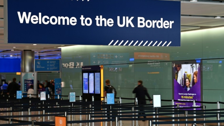 A large sign welcomes travellers arriving at passport control in Terminal 2 at London's Heathrow Airport